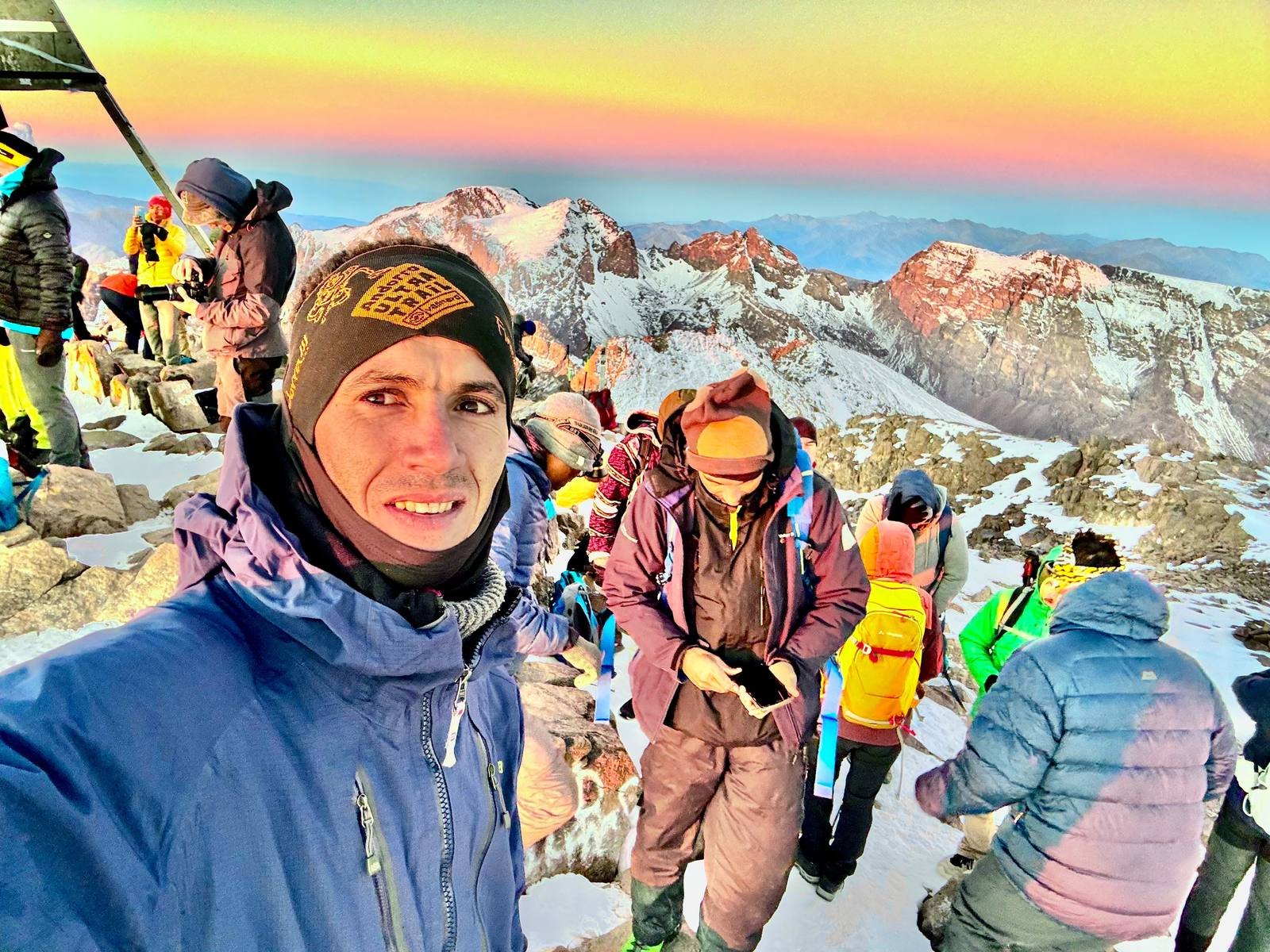 Saïd, Kasbah Oasis mountain guide, at the summit of Mount Toubkal at sunrise